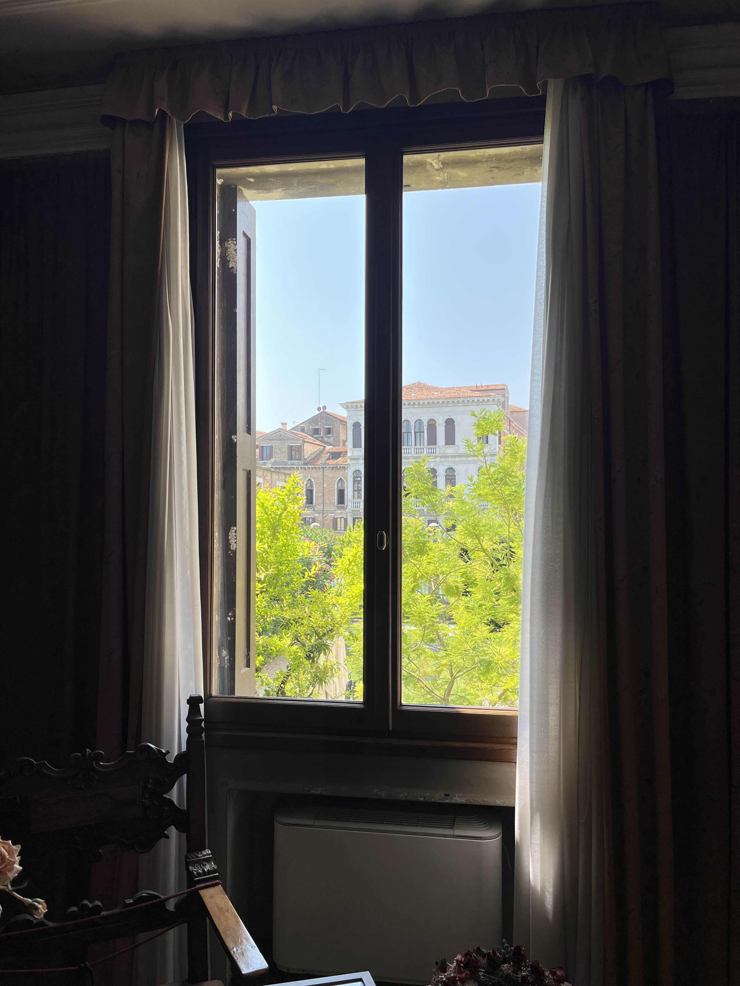 Looking out of a window in a museum in Venice