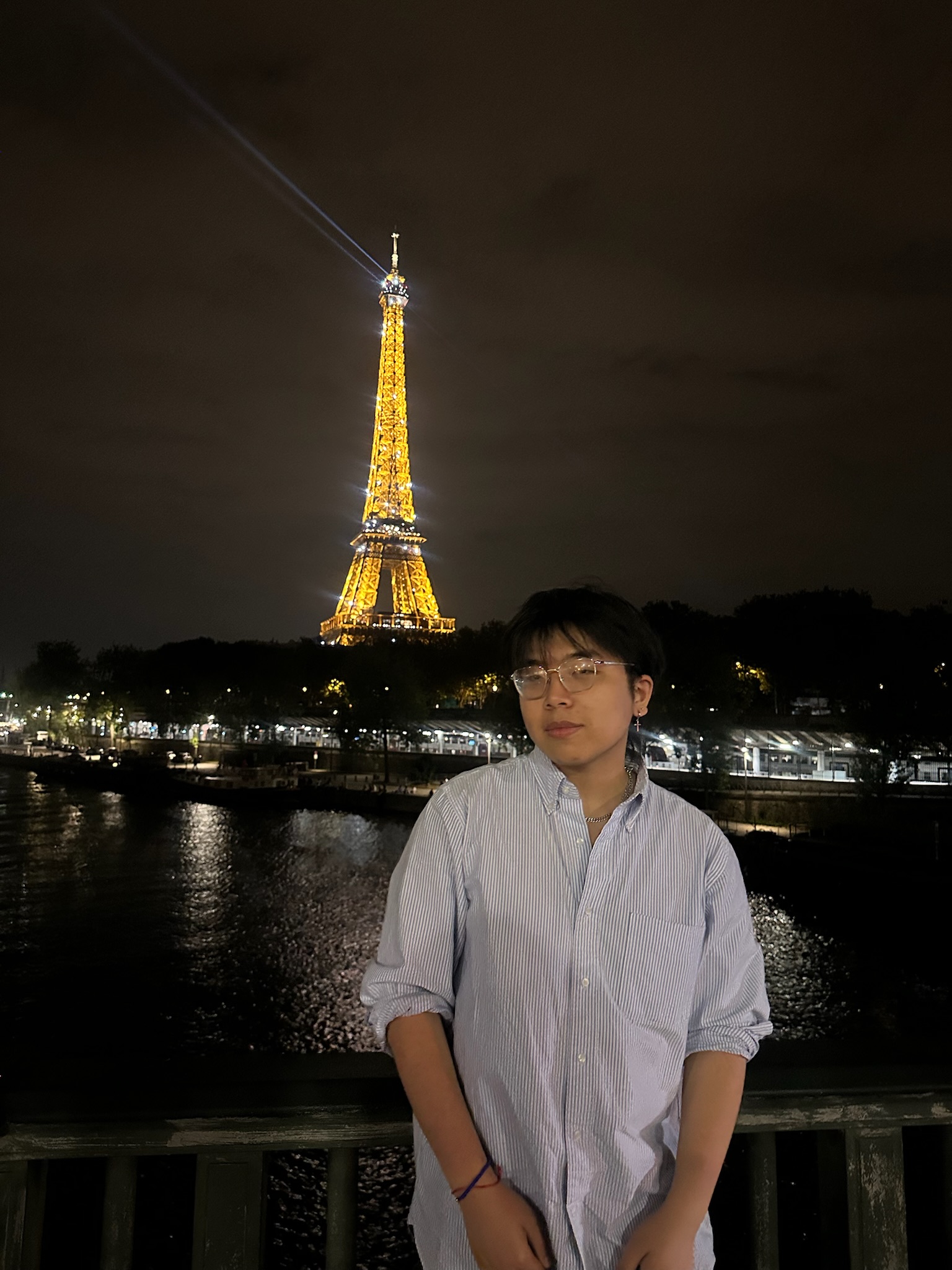 Richie standing in front of the Effiel Tower 