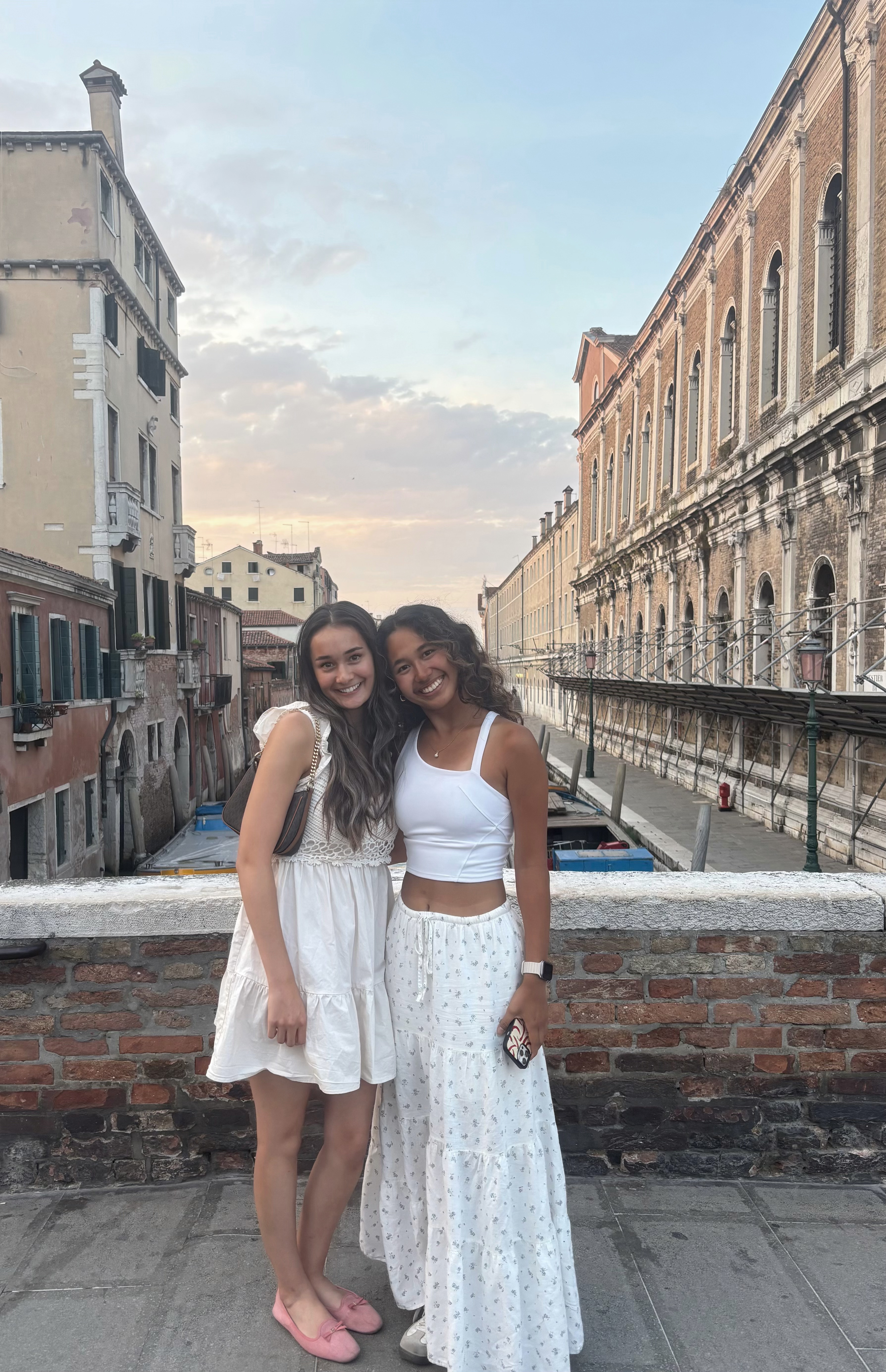 Katrina standing with friend near the canals of Venice