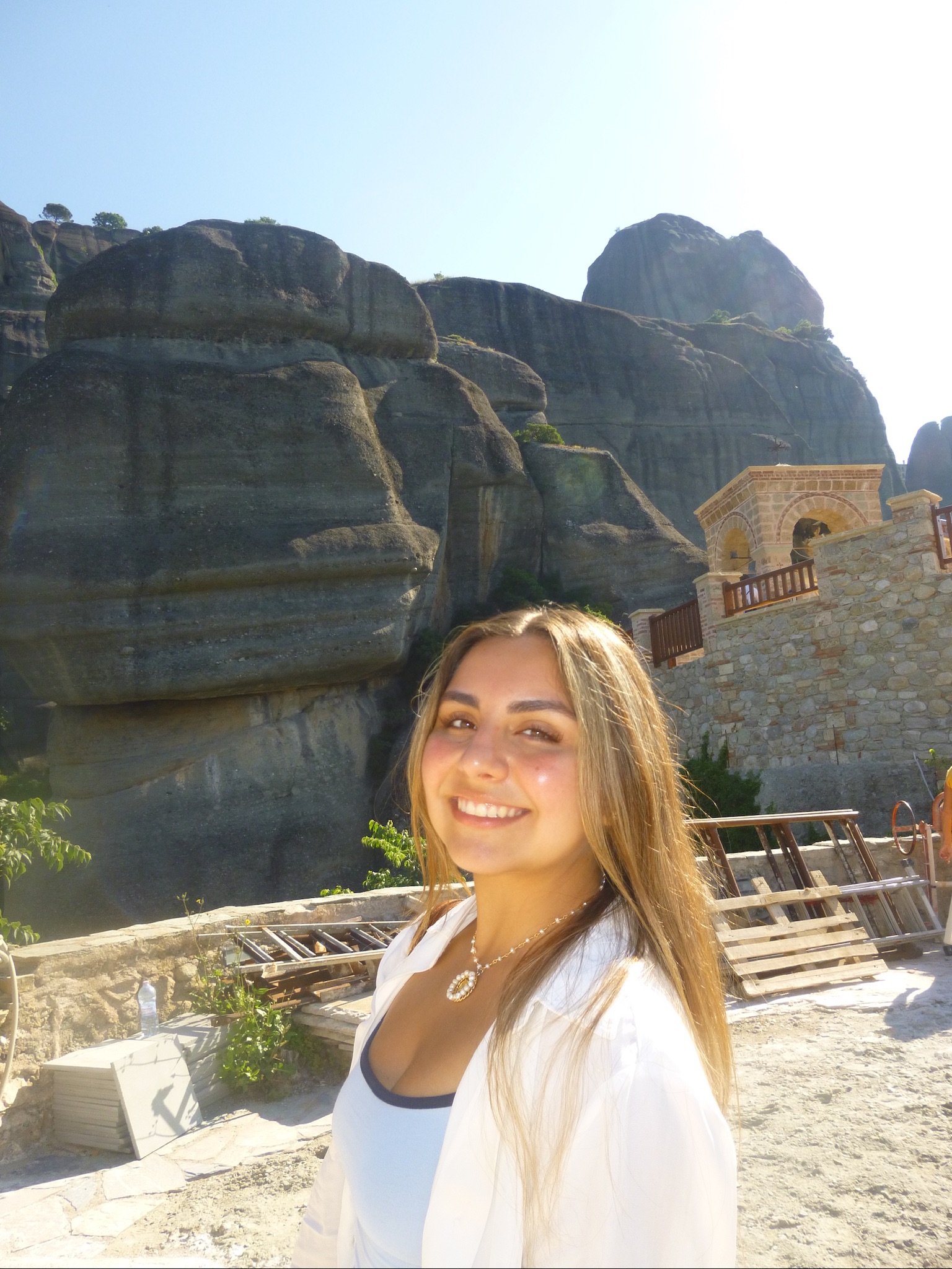 Regina taking a selfie while walking around an archelogical site in Greece