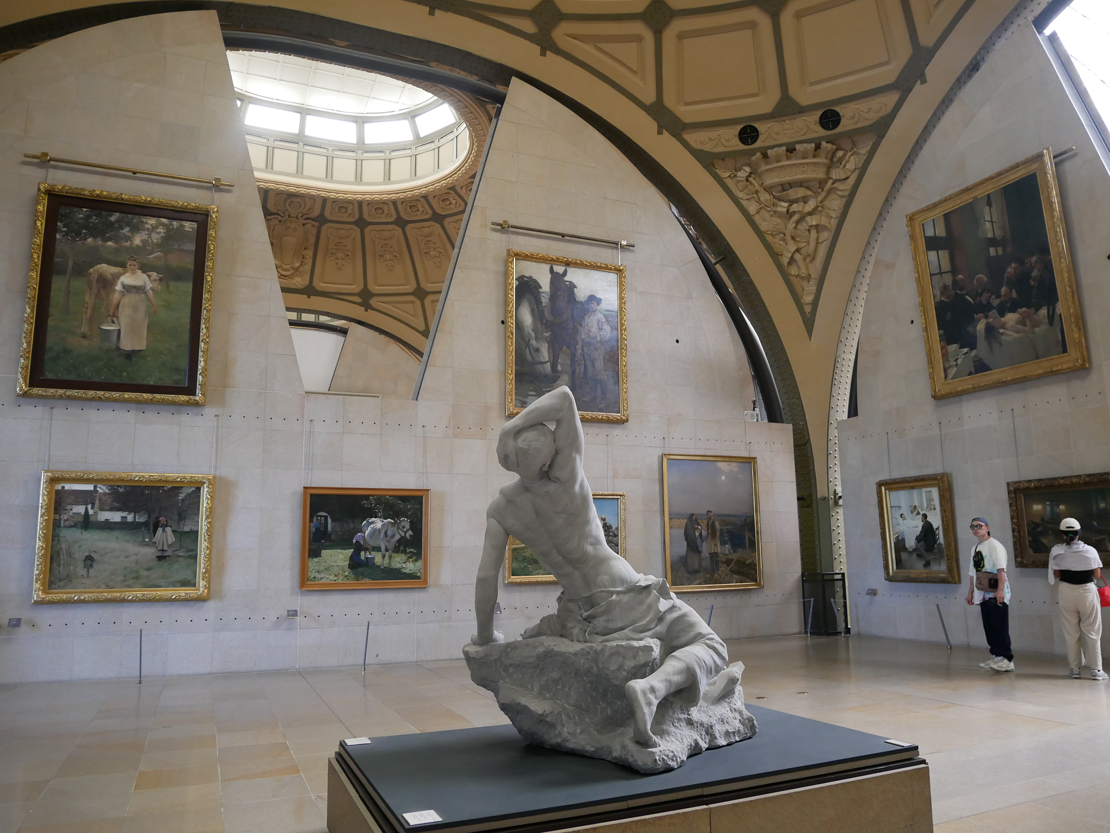 Statue and paintings inside a museum