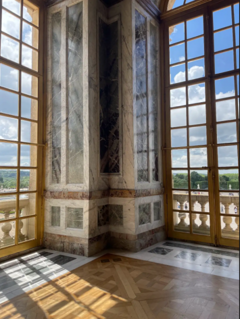 Looking out of large windows in a museum in Paris