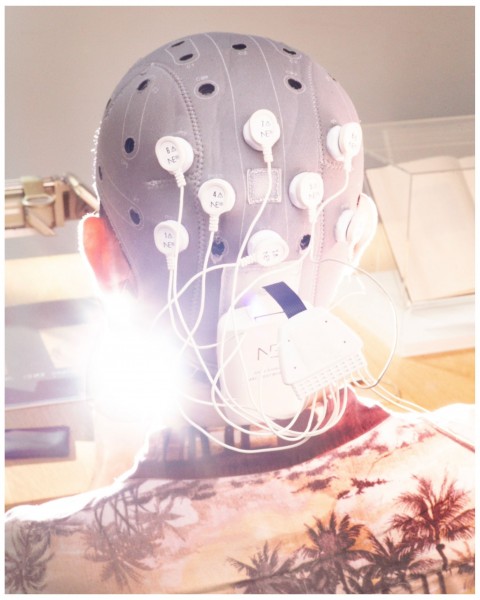 A person's head connected to electrodes