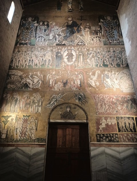 Hand paintings on the front of a building in Venice