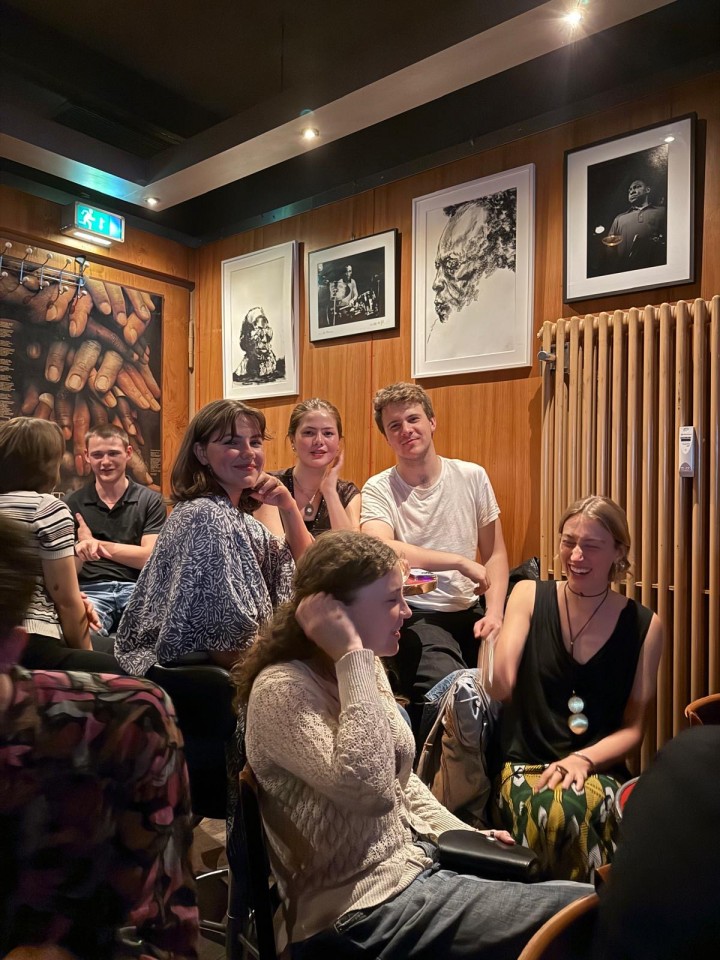 Autumn sitting and laughing with friends in a resturant