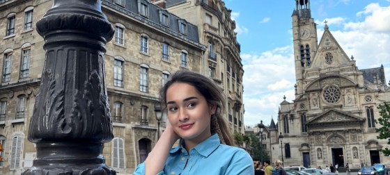 Katrina Rose Machett smiling to the camera in Paris