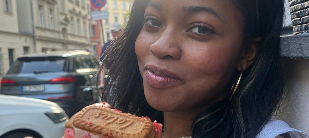 Victoria eating a Berliner donut