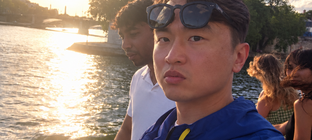 Yan on the river with a sunset