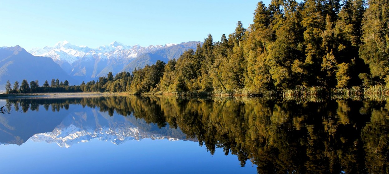 Image of water, mountains, and woods in Otago