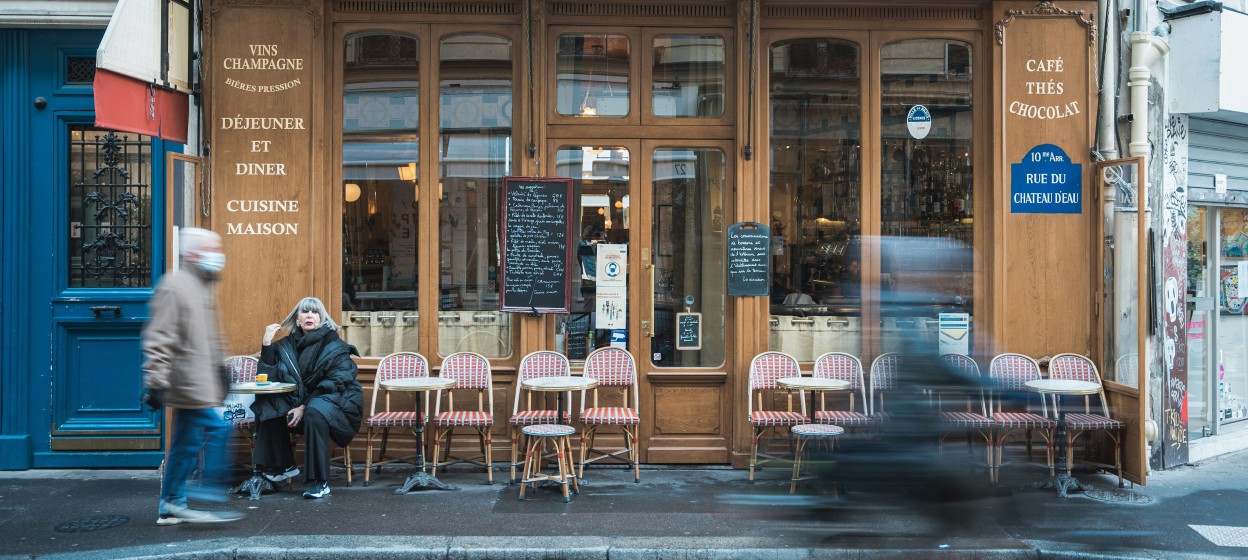 A cafe in Paris with a red aweing