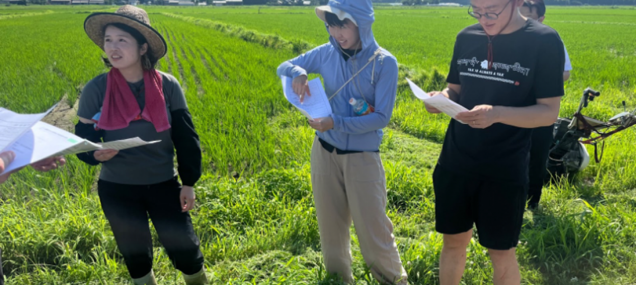 Students standing in a field