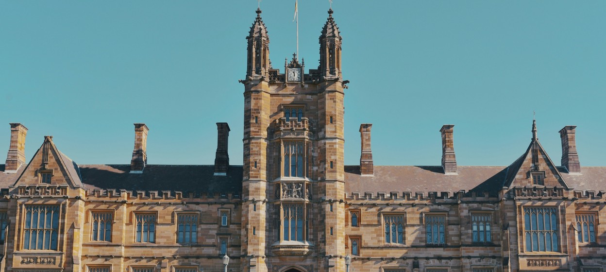 Brown concrete building during daytime at the University of Sydney