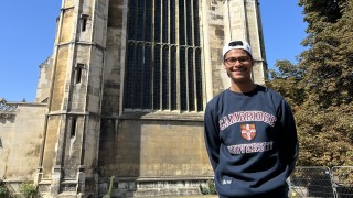 Albaraa Gebril standing in front of a building at Cambridge