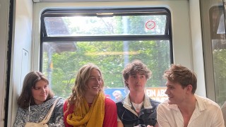 Students sitting on the U Bahn in Berlin
