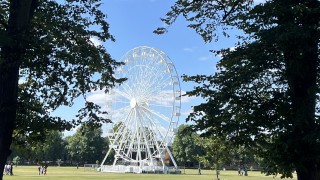 A park with a ferris wheel in Cambridge U.K.