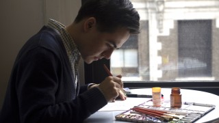 Myles Zhang working on a watercolor