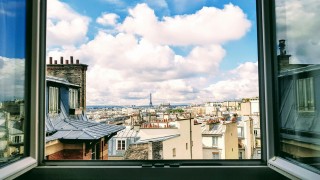 Looking out of a window in an apartment on Rue la Fayette in downtown Paris take by Isaiah Bekker on Unsplash 