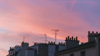 Tops of building in Paris as the sunsets taken by Remi Bertogliati on Unsplash