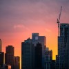 Skyline of Melbourne, Australia during a sunset with colors of yellow and pink